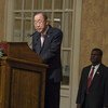 Ban Ki-moon speaks at a podium during a formal meeting with a United Nations flag in the background.