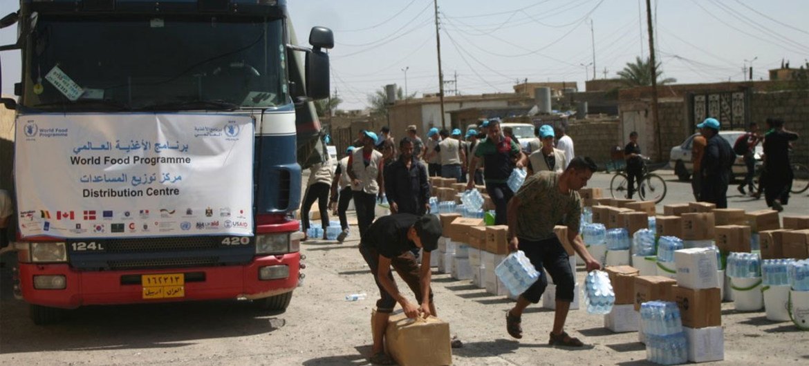 Le PAM distribue une assistance alimentaire à des milliers de personnes à Qayyarah, en Iraq. Photo Women Empowerment Organization (WEO)