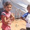 Дети  возле своих палаток  в западной части  Алеппо. Фото ЮНИСЕФ
