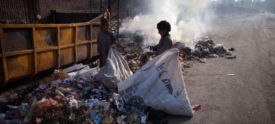 Children collect garbage in Lahore, State of Punjab, Pakistan.