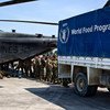 US Marines unloading over 12 tonnes of food items from a World Food Programme (WFP) truck onto helicopters to be sent to Jeremie, Haiti, which was severely hit by Hurricane Matthew.