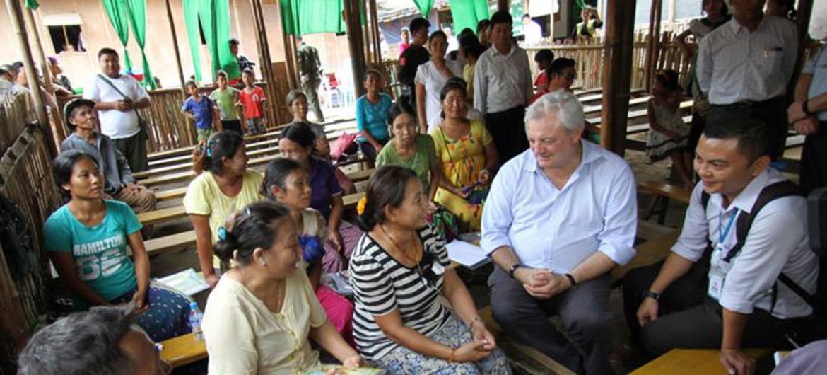 Under-Secretary-General for Humanitarian Affairs, Stephen O’Brien (second right), speaks to people in Kachin state, Myanmar, who are still still displaced after five years of conflict.