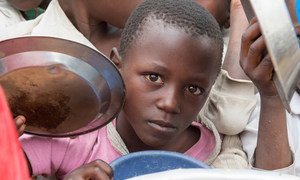 Pupils receive lunch at Bwerangula Primary School in Kitchanga, North Kivu, eastern Democratic Republic of the Congo.