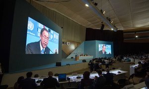 Secretary-General Ban Ki-moon (on wide screens) addresses the opening of the United Nations Conference on Housing and Sustainable Urban Development (Habitat III).