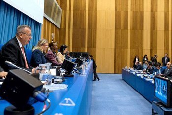 Executive Director of UNODC Yury Fedotov (left) addresses the eighth session of the Conference of the Parties to the UN Convention on Transnational Organized Crime.