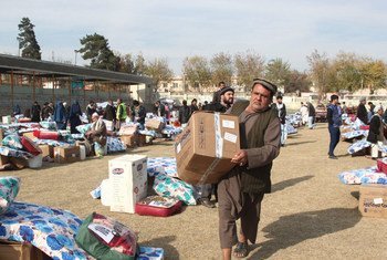 War-affected Kunduz civilians receive humanitarian assistance.