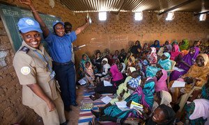 Women in Abu Shouk Camp for internally displaced persons (IDPs) near El Fasher, North Darfur, attend English classes conducted by volunteer teachers and facilitated by the police component of the African Union-United Nations Hybrid Operation in Darfur (UNAMID).