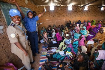 Women in Abu Shouk Camp for internally displaced persons (IDPs) near El Fasher, North Darfur, attend English classes conducted by volunteer teachers and facilitated by the police component of the African Union-United Nations Hybrid Operation in Darfur (UNAMID).
