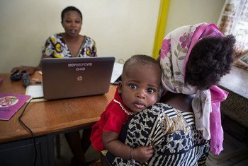 A baby has his general health recorded by a data clerk, as part of an effort to monitor levels of pneumonia post-vaccination in Kilifi District, Kenya. Photo: GAVI Alliance/Evelyn Hockstein