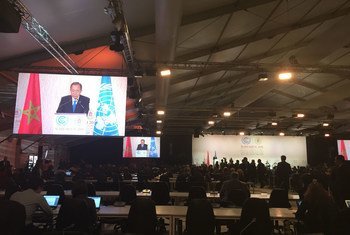 Secretary-General Ban Ki-moon (on screens) addresses a high-level event on accelerating climate action in Marrakech.