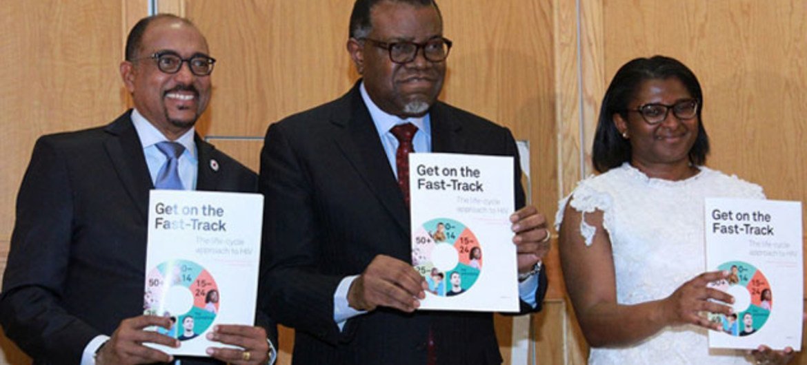 Executive Director of UNAIDS, Michel Sidibé (left) with President of Namibia, Hage Geingob and his wife Monica, at the launch of Get on the Fast-Track: the life-cycle approach to HIV, in Windhoek, Namibia.