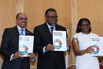 Executive Director of UNAIDS, Michel Sidibé (left) with President of Namibia, Hage Geingob and his wife Monica, at the launch of Get on the Fast-Track: the life-cycle approach to HIV, in Windhoek, Namibia.