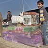 Иракские переселенцы получают гуманитарную помощь Фото ООН/Рашид Хуссейн Рашид