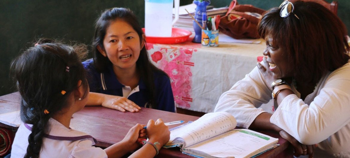 WFP Executive Director Ertharin Cousin (right) talks to a student at Park Chim school in Luang Prabang Province, Laos.