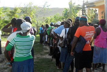 Haitians line up to receive bags of planting seeds in Jeremie, Grand'Anse Department, one of the areas hit hardest by Hurricane Matthew.