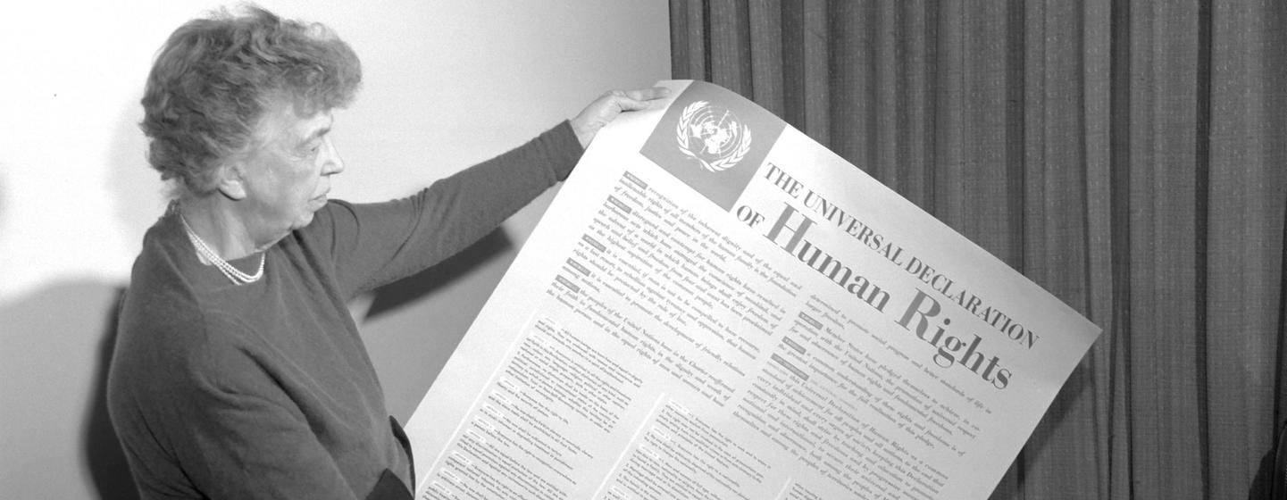 Eleanor Roosevelt of the United States holding a Universal Declaration of Human Rights poster in English in 1949. (file)