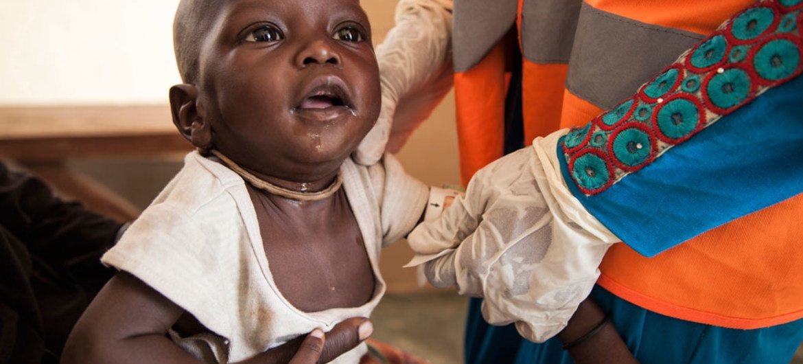 A 7 month old boy is assessed for malnutrition by a UNICEF Nutrition Officer at a UNICEF-supported health clinic at Muna Garage IDP camp, Maiduguri, Borno State, northeast Nigeria.