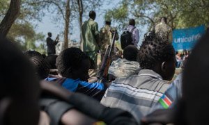 On 26 October 2016, children associated with the Cobra faction wait to be demobilized in Pibor, South Sudan. A total of 145 children from the Cobra Faction and SPLA-IO were disarmed and released by the two armed groups.