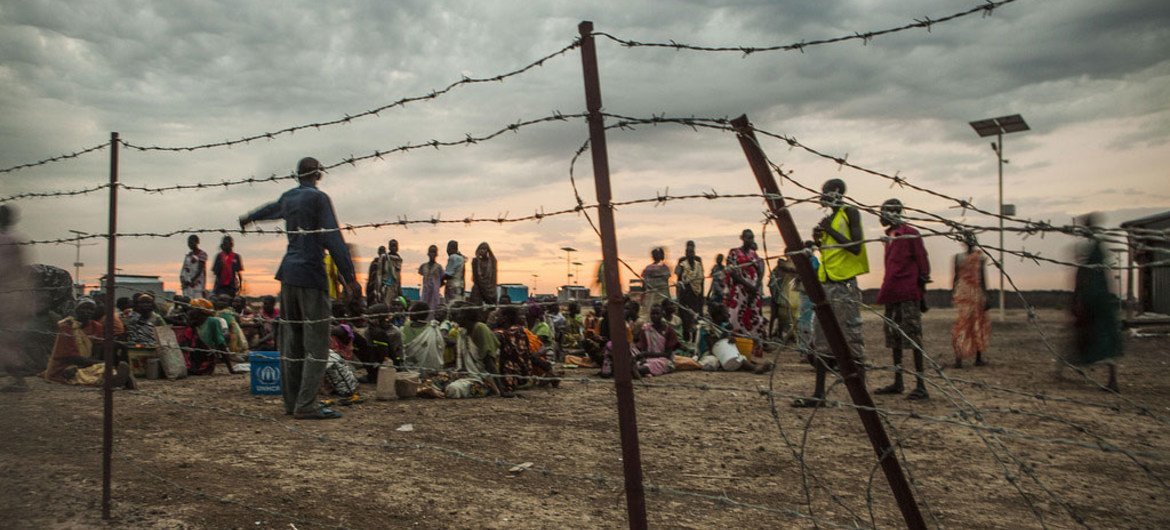 Internally displaced persons (IDPs) line up early in the morning for a general food distribution at the UN Protection of Civilians Site, Malakal, South Sudan.