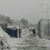 Des migrants et des demandeurs d'asile sur l'île grecque de Lesbos couverte par la neige, en janvier 2017. Photo OIM