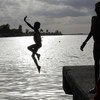 A child takes a dip in a river in the Gambia. (file)