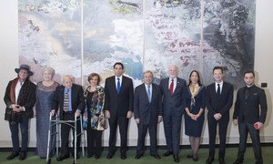Secretary-General António Guterres (fifth right) poses for a group photo with participants of the UN Holocaust Memorial Ceremony, on the occasion of the International Day of Commemoration in Memory of the Victims of the Holocaust.