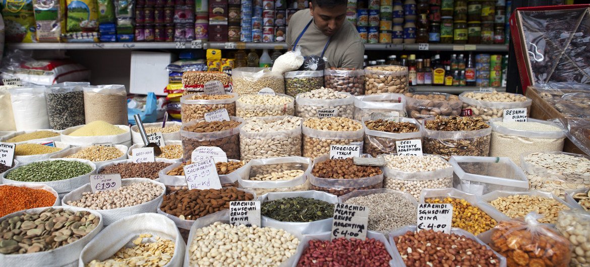 Pulses and dried fruits for sale at a market in Rome.