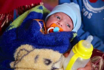 A baby displaced by the conflict in Mosul, shelter at the Qayara emergency site, in Ninewa governorate, Iraq.