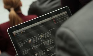 A person browsing through social media on their laptop computer (content blurred to protect privacy). File Photo: World Bank