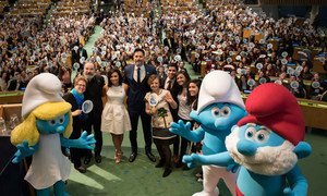 A wide view of the special event for the Sustainable Development Goals (SDGs) attended by voice actors from the upcoming animated movie “Smurfs: The Lost Village” and students from the international Model UN conference to celebrate International Day of Happiness (20 March).