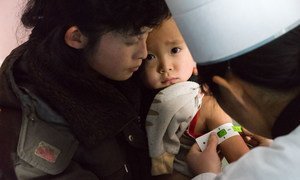 Children in a newly built clinic in Musan County, Democratic People’s Republic of Korea (DPRK), are checked for malnutrition and given vaccines, Vitamin A and deworming tablets. Photo: UNICEF/Simon Nazer