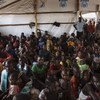 Des réfugiés sud-soudanais attendent d'être enregistrés au centre de réception d'Imvepi, dans le nord de l'Ouganda, en mars 2017. Photo HCR/David Azia