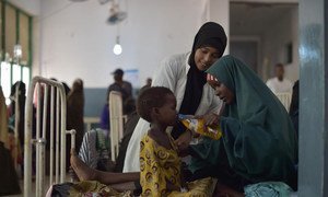 A mother gives her daughter a drink of rehydrating salts at a hospital in Mogadishu, Somalia. The country is currently experiencing a severe drought and UN humanitarian response has been upped to prevent the situation from worsening. March 2017.