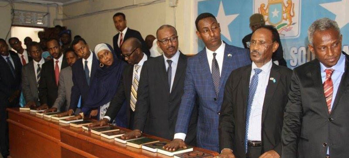 Members of the new cabinet of the Government of Somalia take the oath of office.