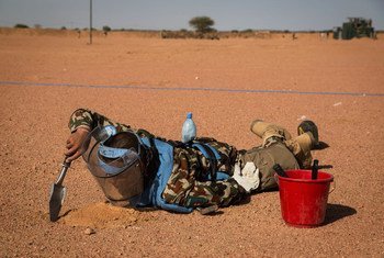 A UN peacekeeper performing "Battle Area Clearance" - finding and removing explosives - at an airstrip in Kidal, northern Mali.