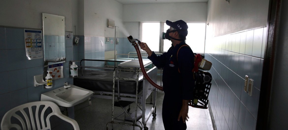 An individual sprays insecticide at a health facility in Cúcuta, Colombia. (file)