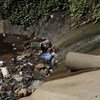 Water, along with pollutants and contaminating agents, flows into a canal in Maputo, Mozambique. (File)