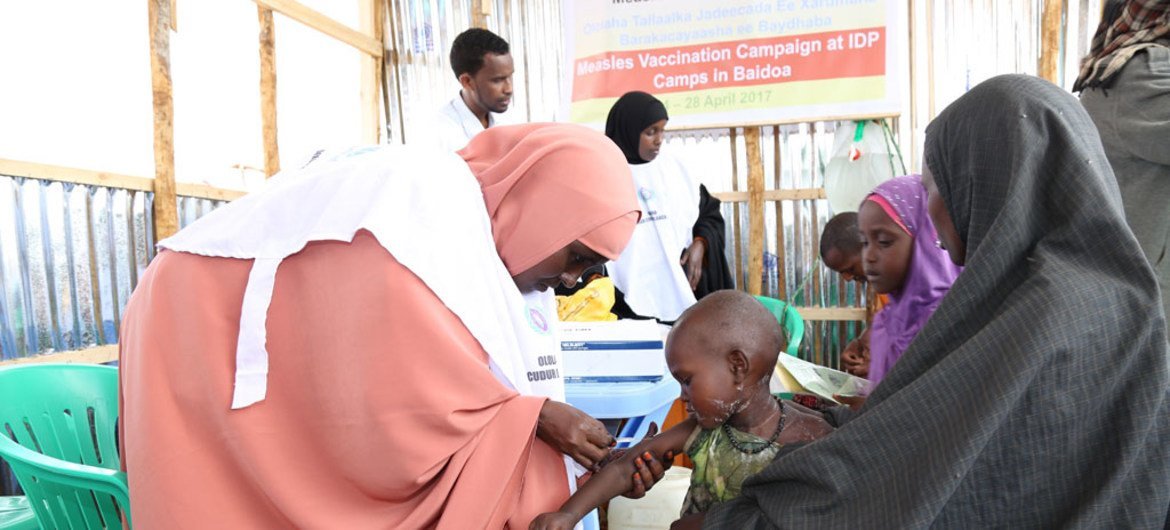 On 24 April 2017, a child is vaccinated against measles at the vaccination campaign launch at Beerta Muuri camp in Baidoa, Somalia.