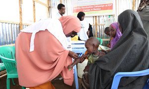On 24 April 2017, a child is vaccinated against measles at the vaccination campaign launch at Beerta Muuri camp in Baidoa, Somalia.
