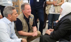 Executive Director of the World Food Programme (WFP), David Beasley (centre) and Regional Director Muhannad Hadi (left) speaking to Nagwan, a 73-year-old woman displaced from her home in Syria. She depends on WFP food assistance.