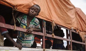 A young South Sudanese refugee looks out of a truck before being transported to the Imvepi settlement at the Imvepi Reception Centre, Arua District, in northern Uganda.