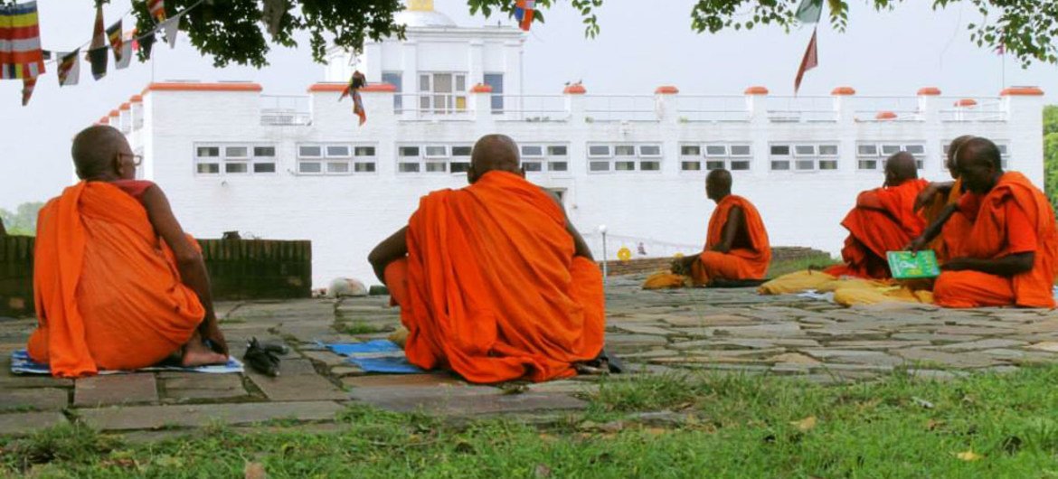Buddhist monks meditate at the Maya Devi Temple in Lumbini, the birthplace of Lord Buddha, Nepal.