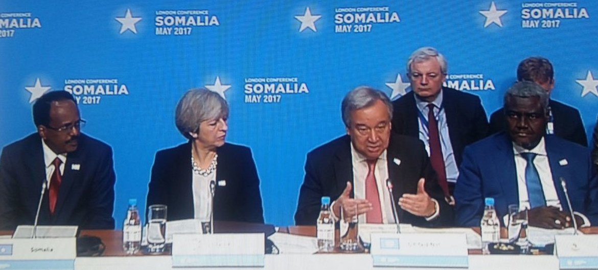Secretary-General António Guterres delivers opening remarks at the London Somalia Conference, seated with [left to right] President Mohamed Abdullahi Mohamed Farmajo of Somalia, British Prime Minister Theresa May and Chairperson of the African Union Commission Moussa Faki Mahamat.