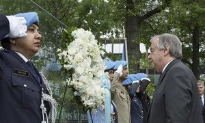 Secretary-General António Guterres (right) lays a wreath in honour of all peacekeepers who lost their lives while serving under the UN flag.