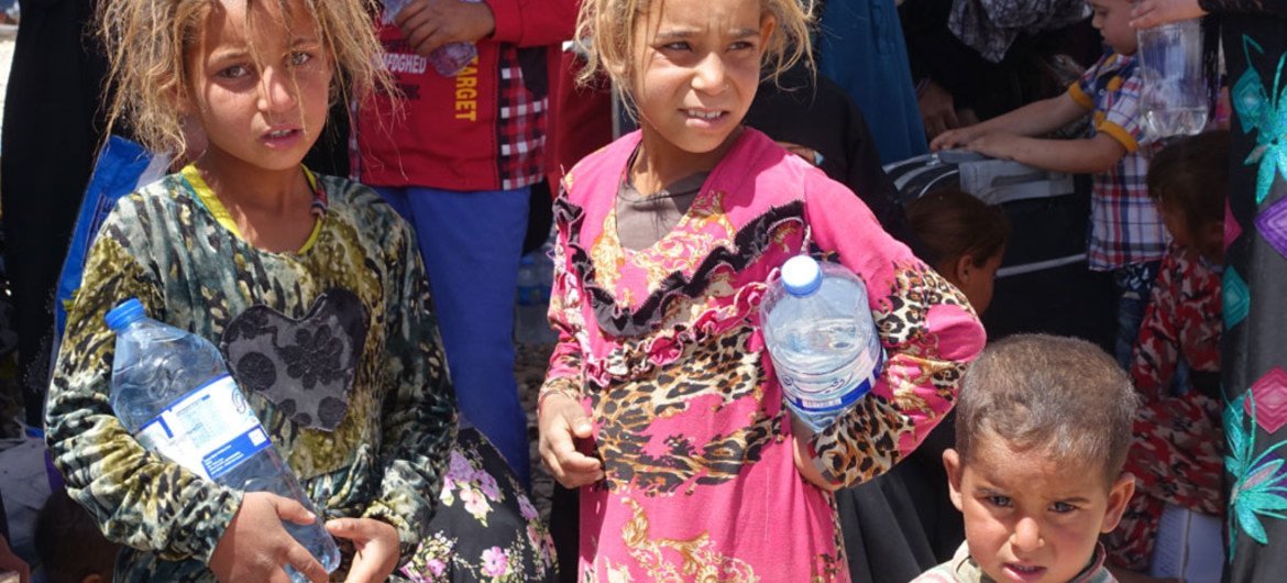 Displaced children in Hammam al-Aleel Camp, among some of the thousands continuing to flee Mosul, Iraq.
