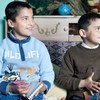 A nine-year-old child and his younger, eight-year-old, brother sit in their room, drawing and colouring. They are living live with foster parents in Lipova commune, Bacau county, Romania.