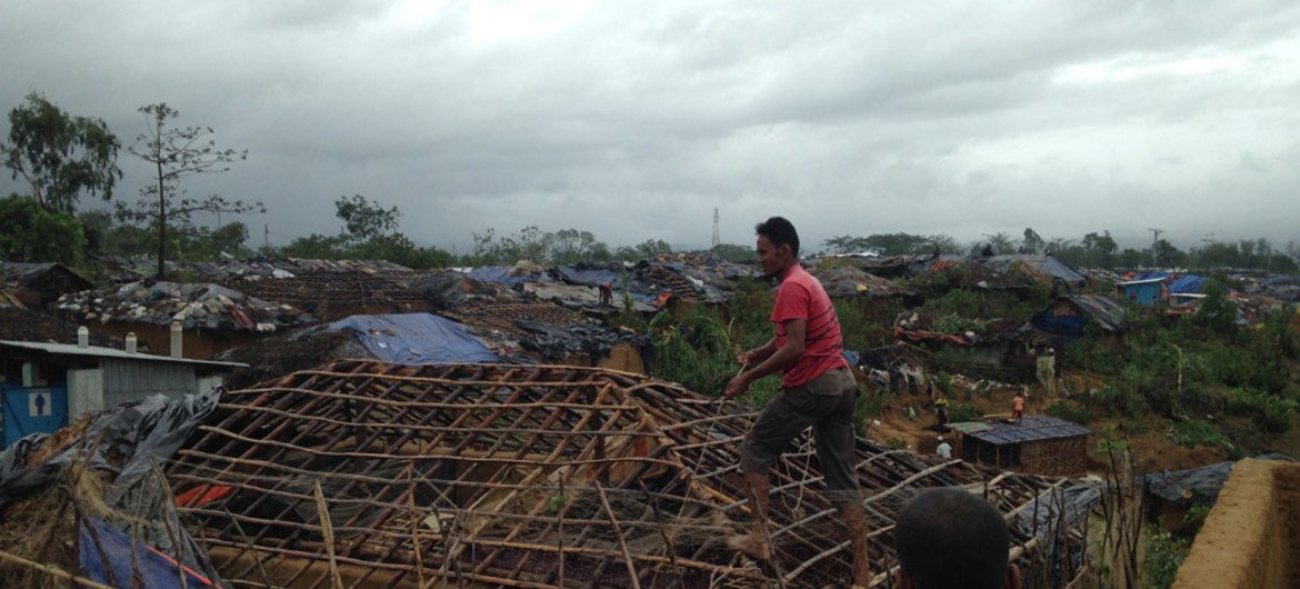 Refugees in Kutupalong camp in Bangladesh rebuild their homes after Cyclone Mora tore through the area.