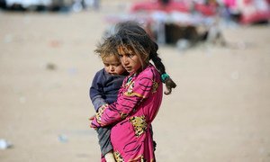 Following the on-going hostilities in Mosul, newly arrived refugees on the way to the Al-Hol camp, close to the Iraqi border in Syria’s north -eastern Hasakeh Governorate. UNICEF/UN037295/Soulaiman (file)