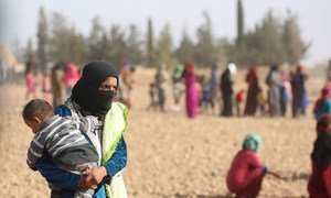 Displaced men, women and children after fleeing ISIL-controlled areas in rural Raqqa to Ain Issa, the main staging point for displaced families, some 50 Km north of Raqqa city (November 2016).