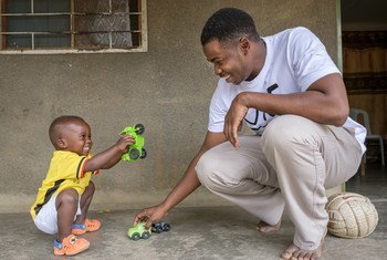 A physiotherapist from Lira, Uganda, plays with his 22-month-old son outside their residence at a hospital compound in Napak, Karamoja, eastern Uganda.